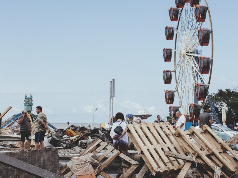Recovering neighborhood with trees at sunset after tornado cleanup in the Huntsville area
